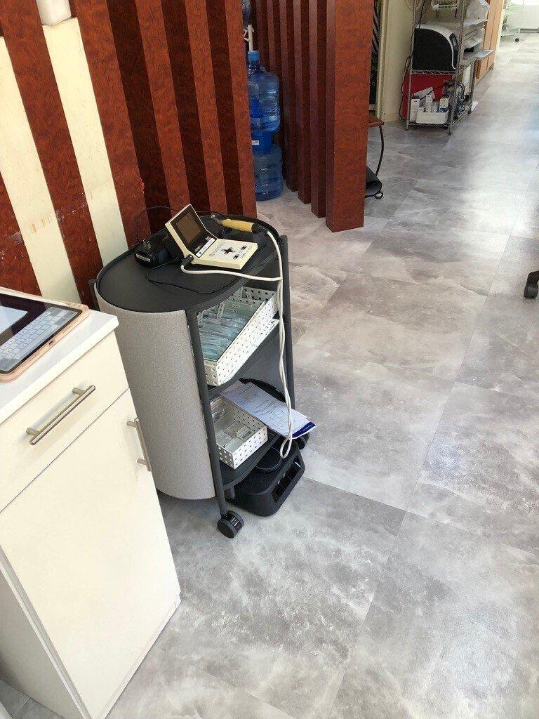 Kachaka transporting treatment equipment within the clinic